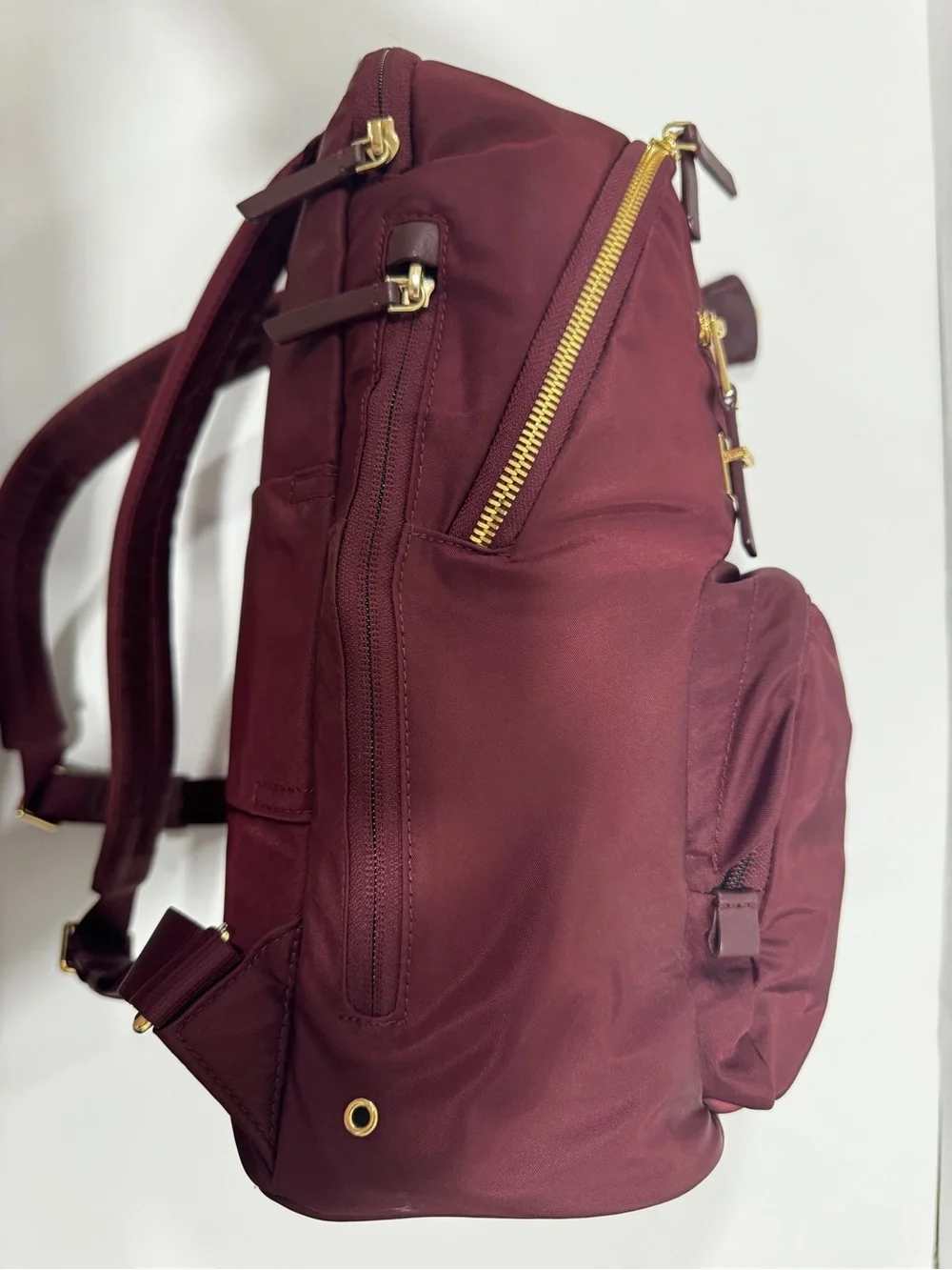 TUMI Unisex Voyageur Hilden Beetroot color Backpack with Gold Hardware